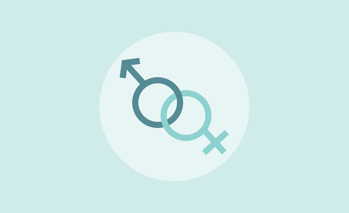 A clean, minimalist graphic on a light blue background features a large white circle in the center. Inside the circle, two gender symbols are interlocked: a darker teal male symbol (circle with an arrow pointing up and to the right) is positioned above and to the left of a lighter teal female symbol (circle with a cross below it). The two circles overlap slightly, creating a sense of connection.